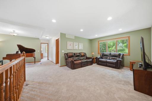 Upstairs, you'll find brand new carpet, an open and airy layout, and more beautiful windows that fill the space with natural light. This level includes two bedrooms, a full bathroom, and a spacious primary suite featuring a walk-in closet and private