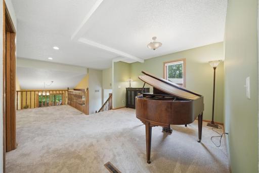 Upstairs, you'll find brand new carpet, an open and airy layout, and more beautiful windows that fill the space with natural light. This level includes two bedrooms, a full bathroom, and a spacious primary suite featuring a walk-in closet and private
