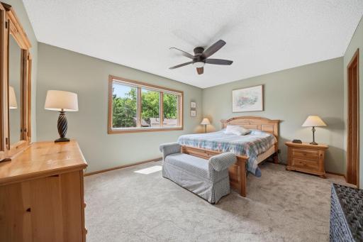 Upstairs, you'll find brand new carpet, an open and airy layout, and more beautiful windows that fill the space with natural light. This level includes two bedrooms, a full bathroom, and a spacious primary suite featuring a walk-in closet and private