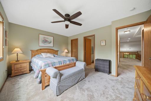 Upstairs, you'll find brand new carpet, an open and airy layout, and more beautiful windows that fill the space with natural light. This level includes two bedrooms, a full bathroom, and a spacious primary suite featuring a walk-in closet and private