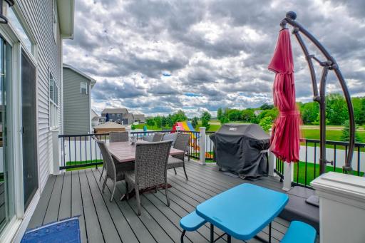 Step outside to the maintenance-free walkout deck overlooking the fenced backyard complete with a playset and irrigation system.