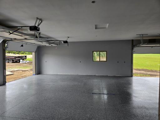 Garage with epoxy floor, in floor heat and 3 separate overhead doors