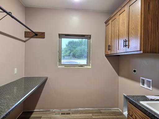 Laundry room next to garage