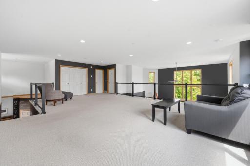 Open to the level below, the loft creates a connected and airy feel throughout the home.