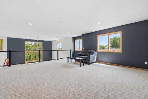 Recessed lighting and large windows ensure a bright and inviting home!