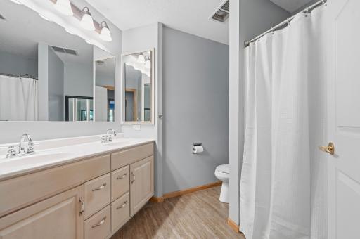 Another beautiful space! The 3/4 primary ensuite is complete with a dual-sink vanity and plenty of storage space.