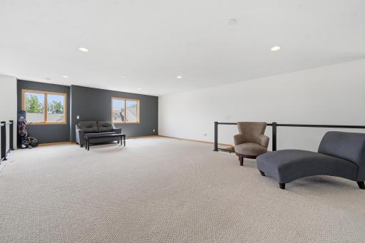 Upstairs, the loft provides additional living space perfect for relaxing, entertaining, or everyday flexibility.