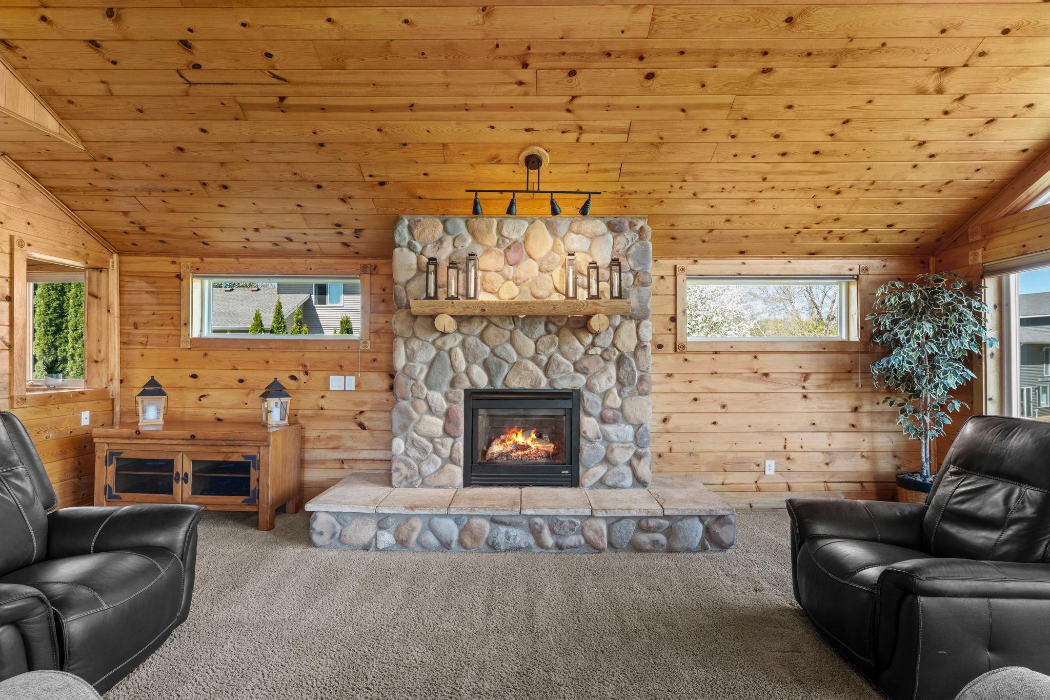 Stone mantel with another gas fireplace