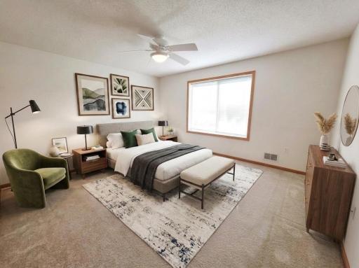 Spacious primary suite featuring generous dimensions and abundant natural light.