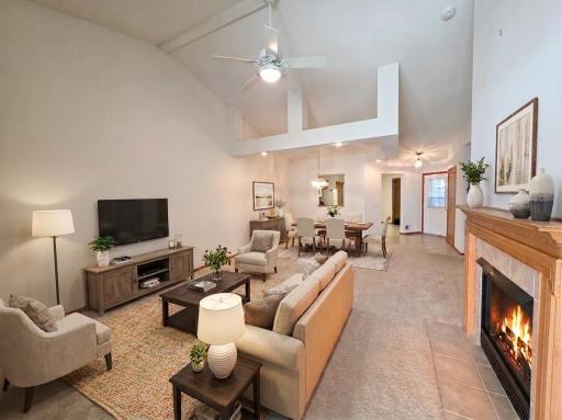 Vaulted living room and dining area showcasing the home's open-concept layout and spacious design.