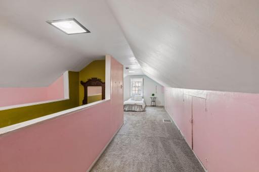 Upper level 4th bedroom has access from the original staircase to the home.