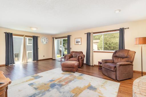 Living Room filled with sunshine, sliders to deck