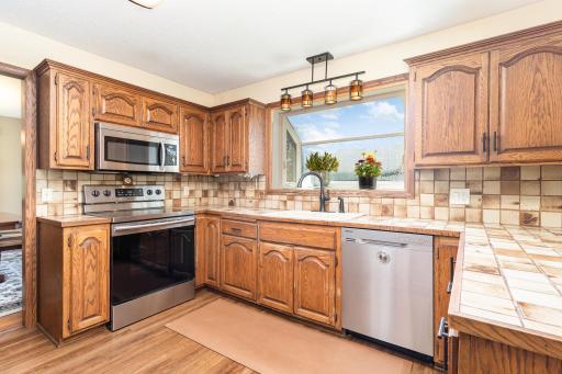 Kitchen with stainless appliances and herb window (new) over sink