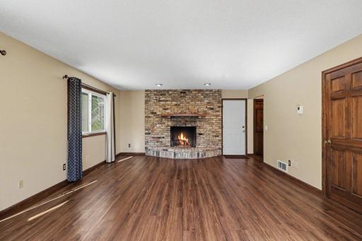 Living room is spacious and offers a gas fireplace.