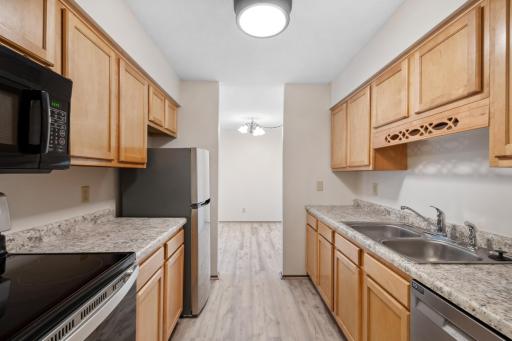 Kitchen includes Newer Stainless Range, Dishwasher, New Refrigerator, New Counter Tops, Fresh Paint & new LVP Flooring