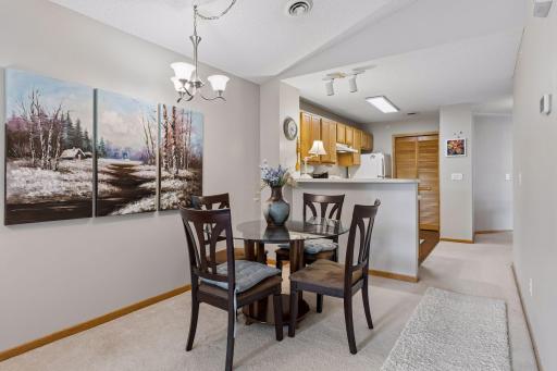 The informal dining and seating area provides a versatile, functional space perfectly suited for both relaxing and entertaining. Dining furnishings are available for inclusion in the sale, offering added ease for the next owner.