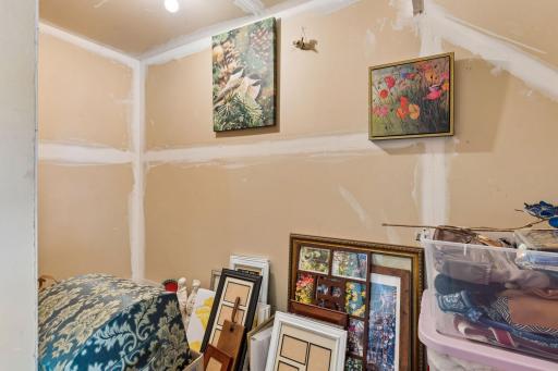 An additional storage room is located off the back of the garage, this is a wonderful space for extra storage that offers a highly functional and convenient space for additional storage needs.