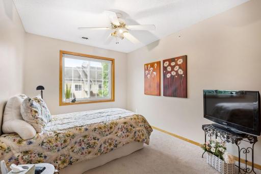 A second bedroom also features southern exposure and new energy-efficient windows, filling the space with natural light while enhancing comfort and efficiency.