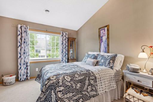The primary suite offers a vaulted ceiling and walk-in closet, complemented by new very expensive triple-pane energy-efficient windows that greatly improve comfort and enhance quietness throughout the space.