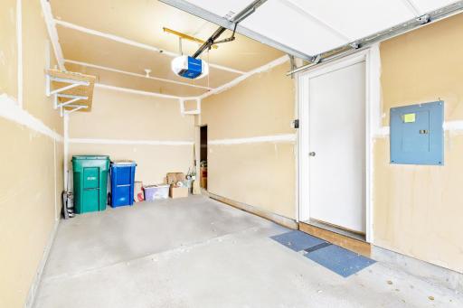 The clean and spacious garage is equipped with an intelligent MyQ smart opener, a new insulated garage door, and updated extra quiet operating hardware for added convenience and efficiency.