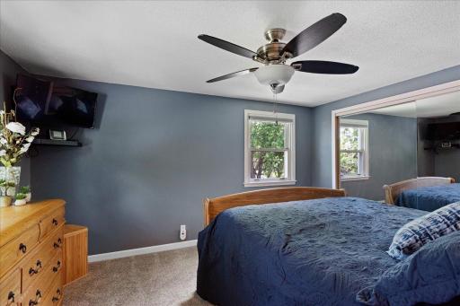 main bedroom with large closet and extra storage cubby within that closet