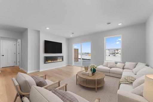 Open floor plan includes a fireplace and walkout patio!