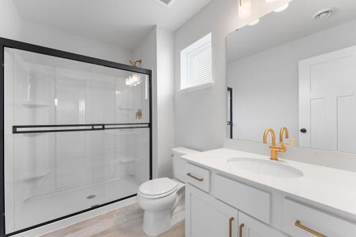 Extras include a bypass shower glass door, quarts countertops and soft-close drawers!