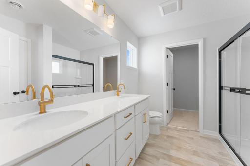 Enjoy dual sinks, an elevated countertop and soft-close drawers!