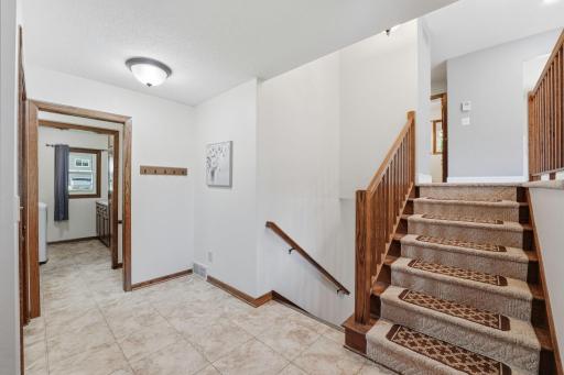 Spacious entry level with 1/4 bath & laundry room.