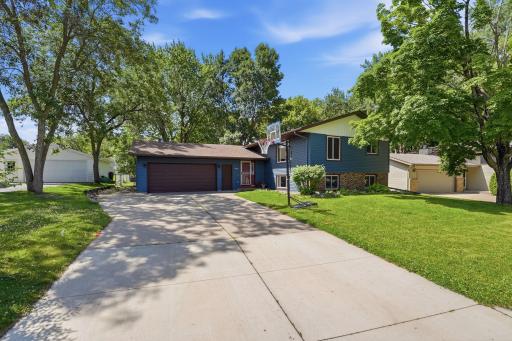 Large concrete driveway with side parking pad.