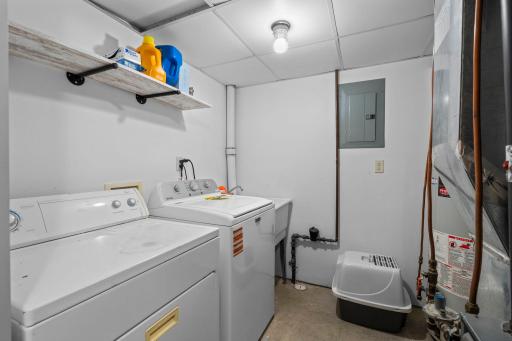 Laundry is a breeze with this lower level laundry room featuring a new washing machine.jpg