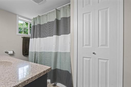Need a full bathroom for long. relaxing soaks in the tub? The main level bathroom has it plus extra storage!.jpg