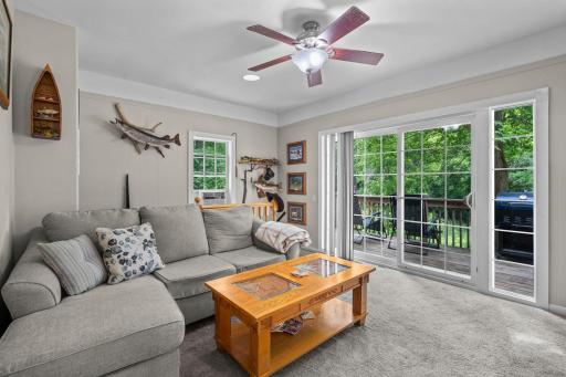 Main level living at it's finest awaits in the updated living room with easy deck access.jpg