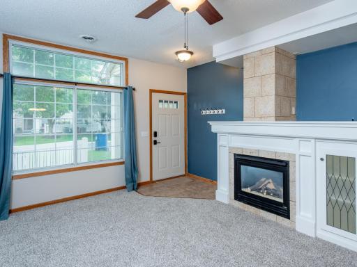 Tiled Entry to coze living room with gas fireplace
