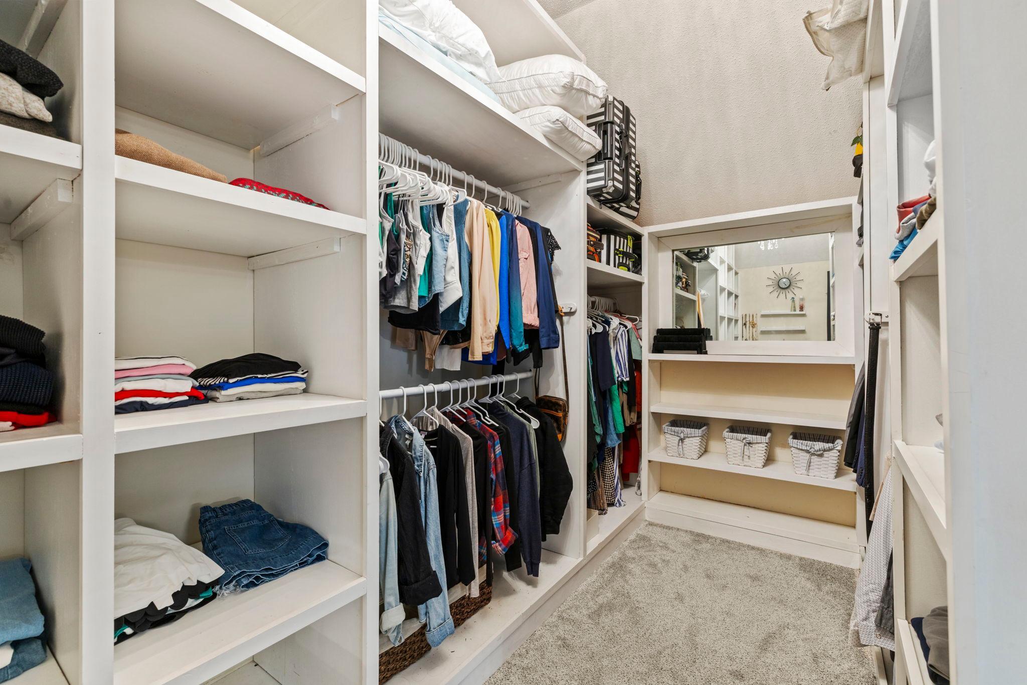 Primary bedroom walk-in closet