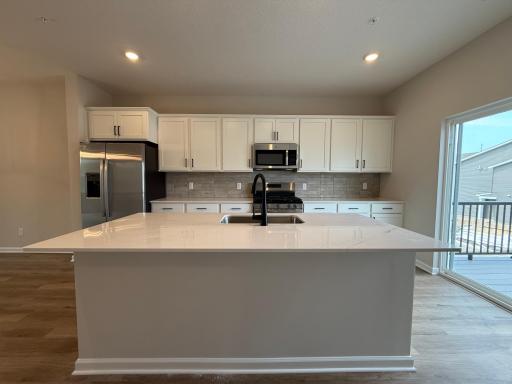 Photo for 13624 Willow Drive, Rogers, MN 55374 - listing #7096612 Welcome to the Barcelona! This home’s kitchen features an oversized island and all the kitchen appliances. With plenty of seating for those on the go for the early mornings!