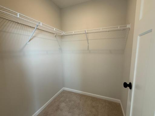 The expansive walk-in closet with plenty of room for a dresser to keep your clothing organized.