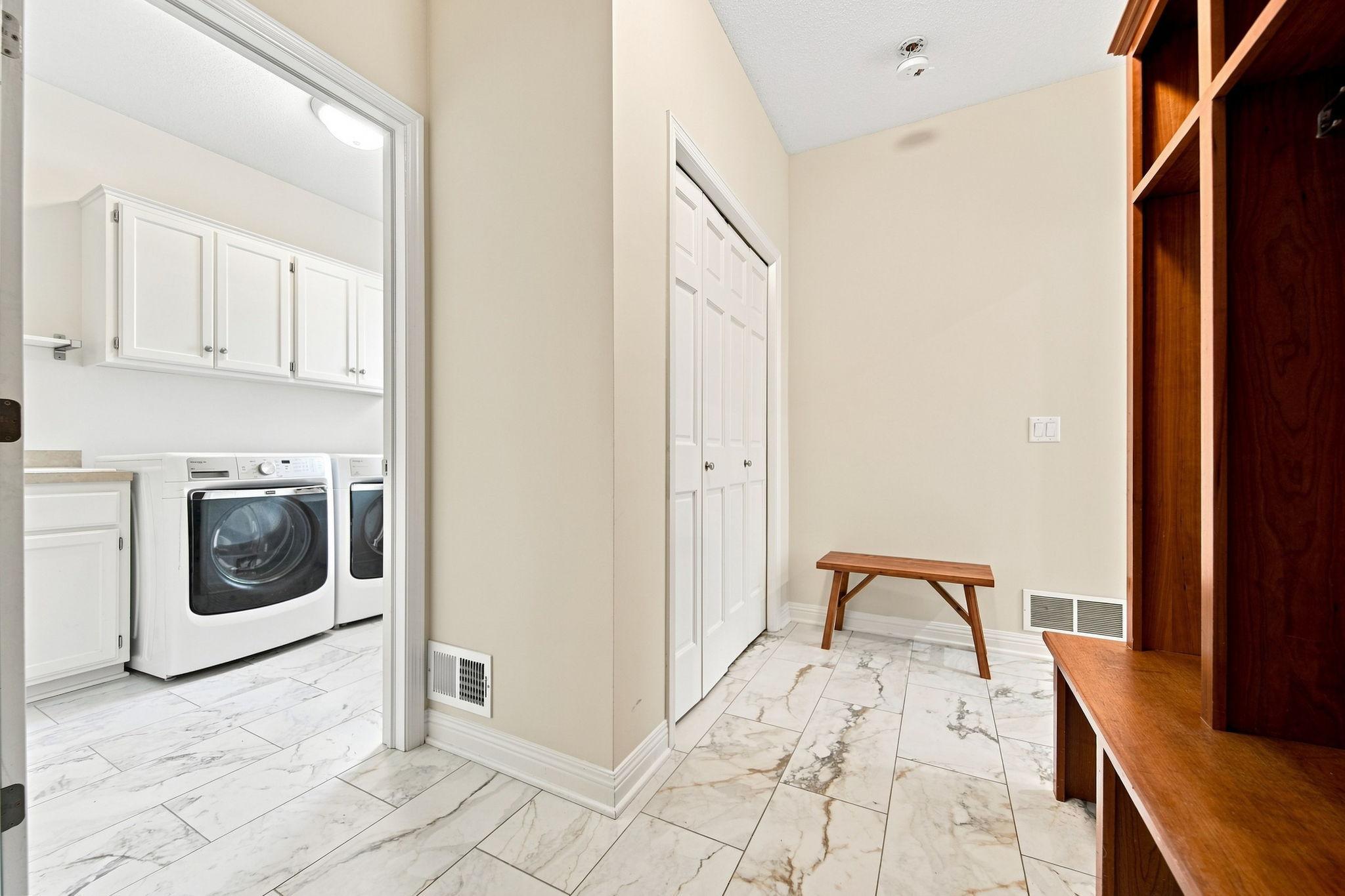 Large entrance into the mudroom w custom Wood lockers