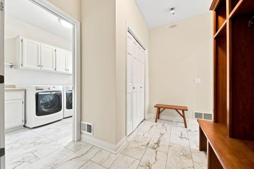 Large entrance into the mudroom w custom Wood lockers