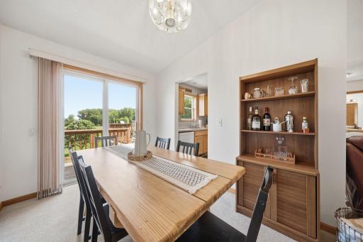 The informal dining room has views of the pond