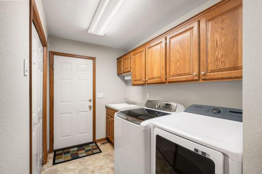 Great mudroom/Laundry area with tons more storage with the cabinets and closet.