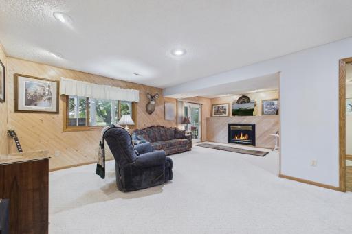 Large family room with walkout to oversized porch on lower level