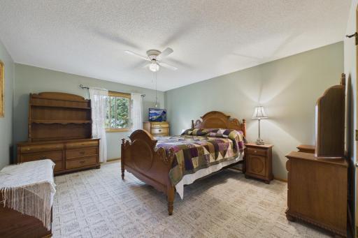 Primary bedroom with walk in closet on upper level