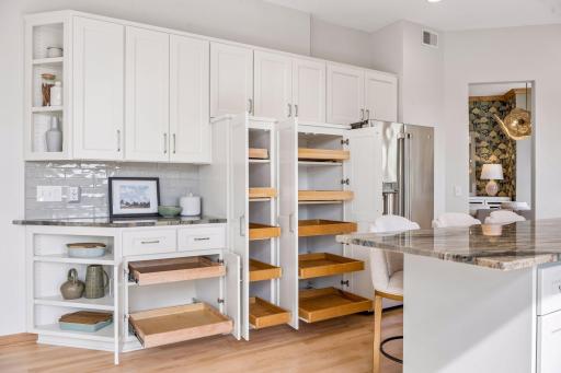 Storage cabinets are fitted with pull out shelving making organizing so easy.