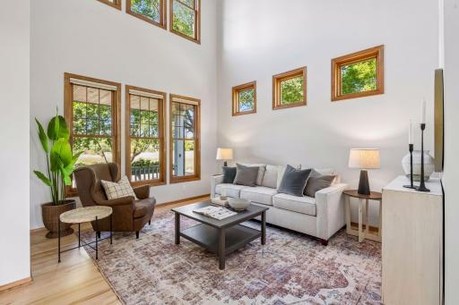 Living room with beautiful windows and wetland views.