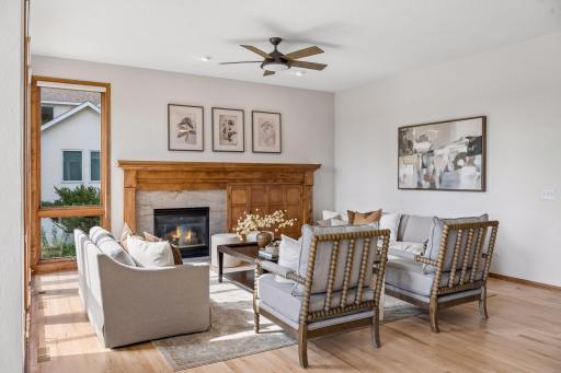 The gathering room. New fireplace hearth and surround. New ceiling fan.