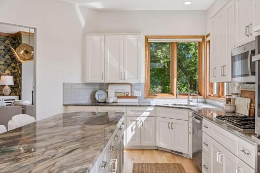Full kitchen remodel. Quartzite island and counter tops. New faucet. Kitchen window overlooks yard and peaceful marsh setting.