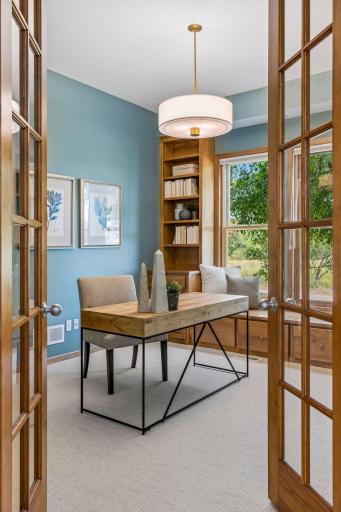 Main floor office with built-in shelves and file system to keep you organized. Views of front garden and the quiet marsh.