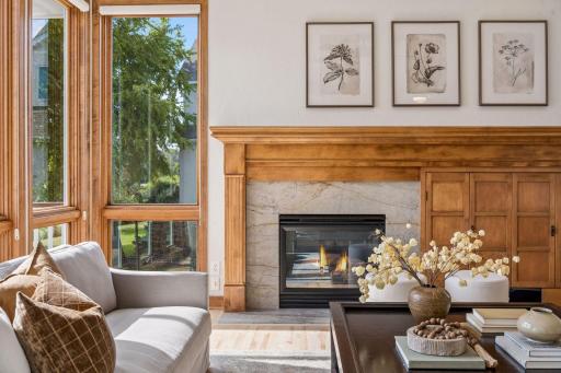 Gathering room with maple hardwood floors, quartzite hearth and fireplace surround.