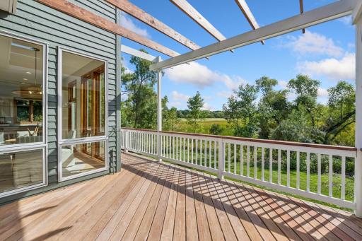 Refreshed deck and railing with drink ledge. New pergola.